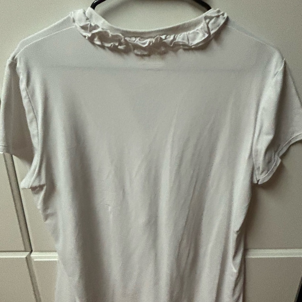 Crisp white Lilly Luxletic XL short sleeve top with ruffles